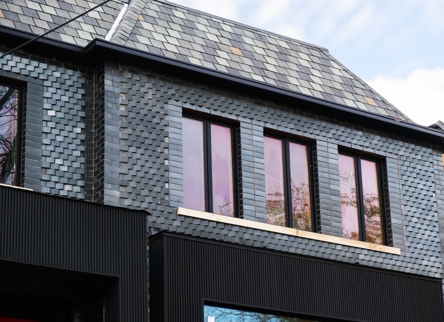 Residential house with dark grey glazed brick.