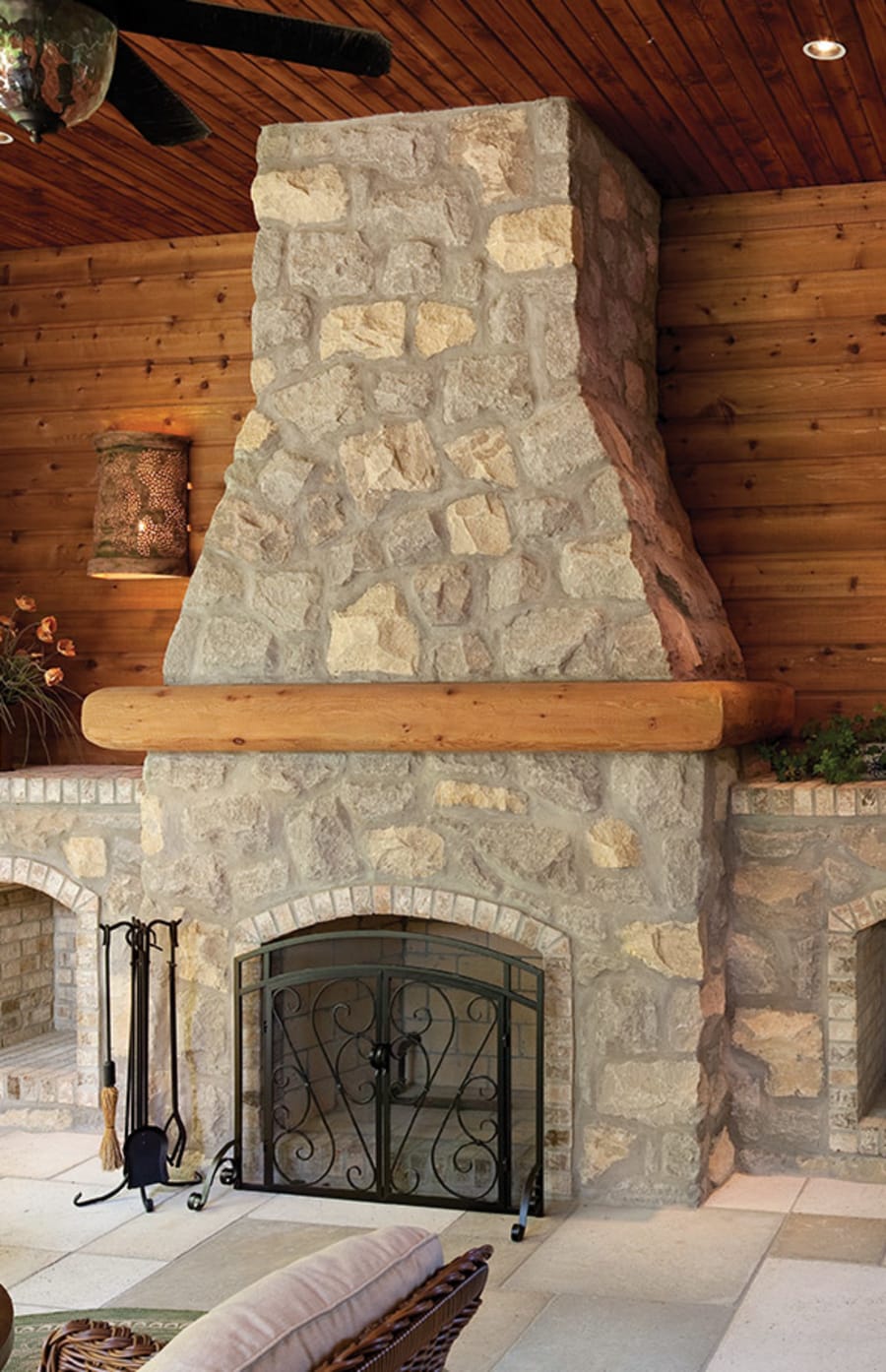 Large fireplace with grey brick.