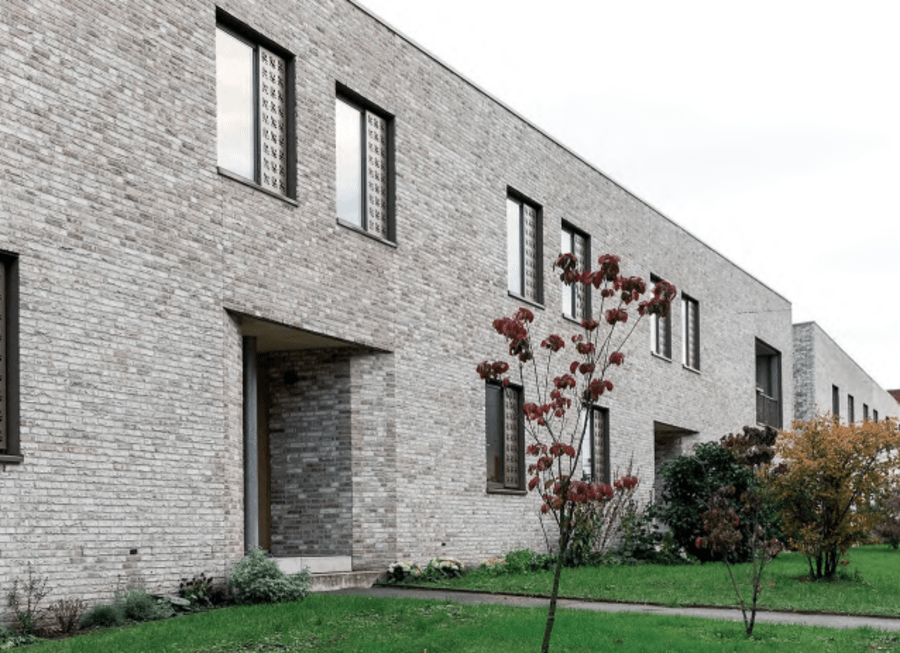 Light grey two story brick building.