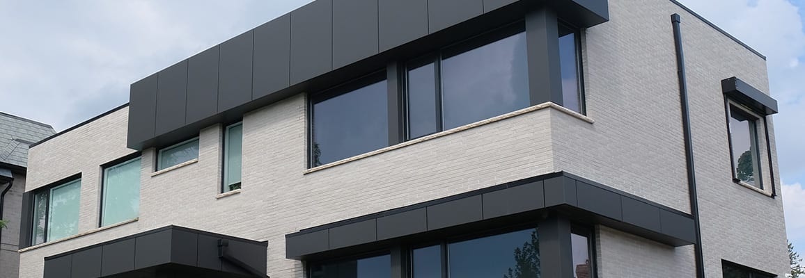 Exterior of light beige multi-level house.