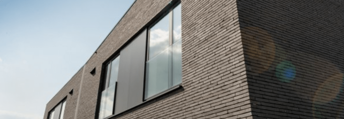 Exterior of a building with dark grey brick.