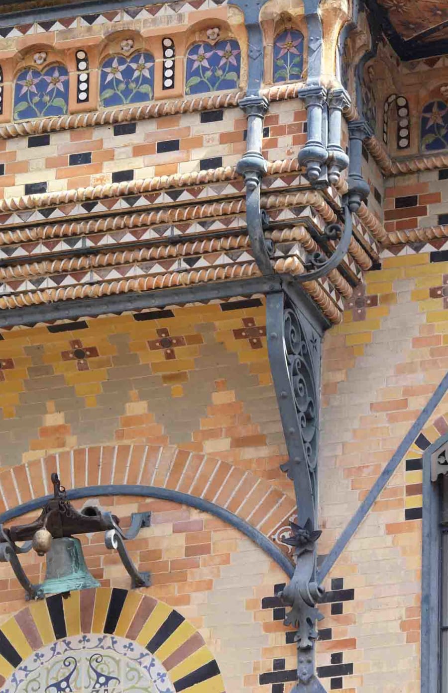 Multi-coloured bricks with various patterns on a vintage building.