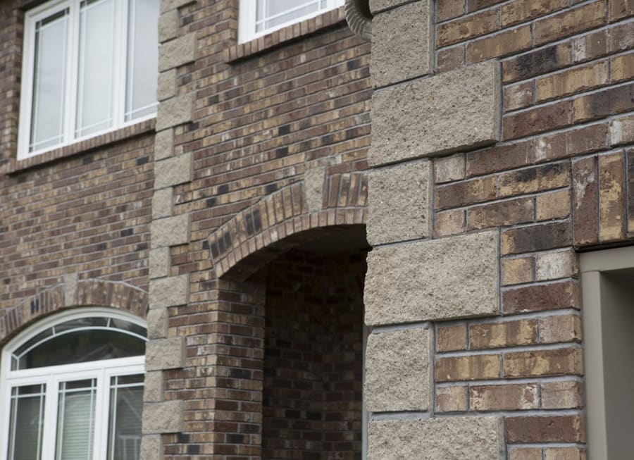 Exterior of a building with light brown brick.