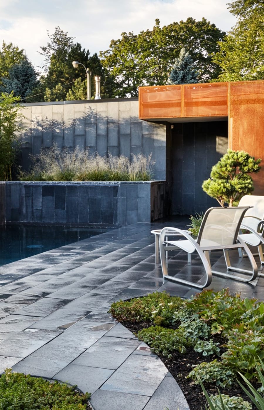 Backyard patio at a residential house with pool.