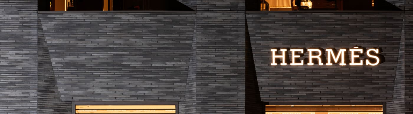 Close up of Hermes building with name lit up