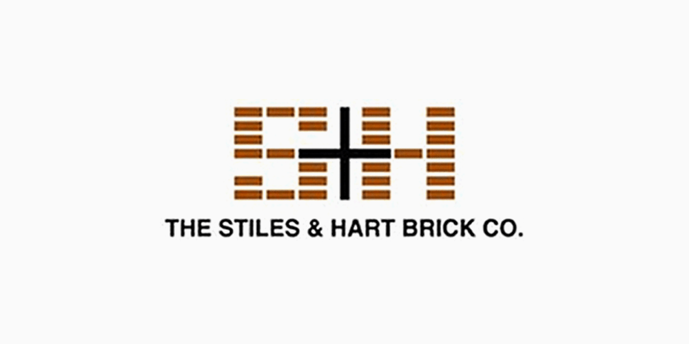 The Tiles and Hart Brick Co. logo.