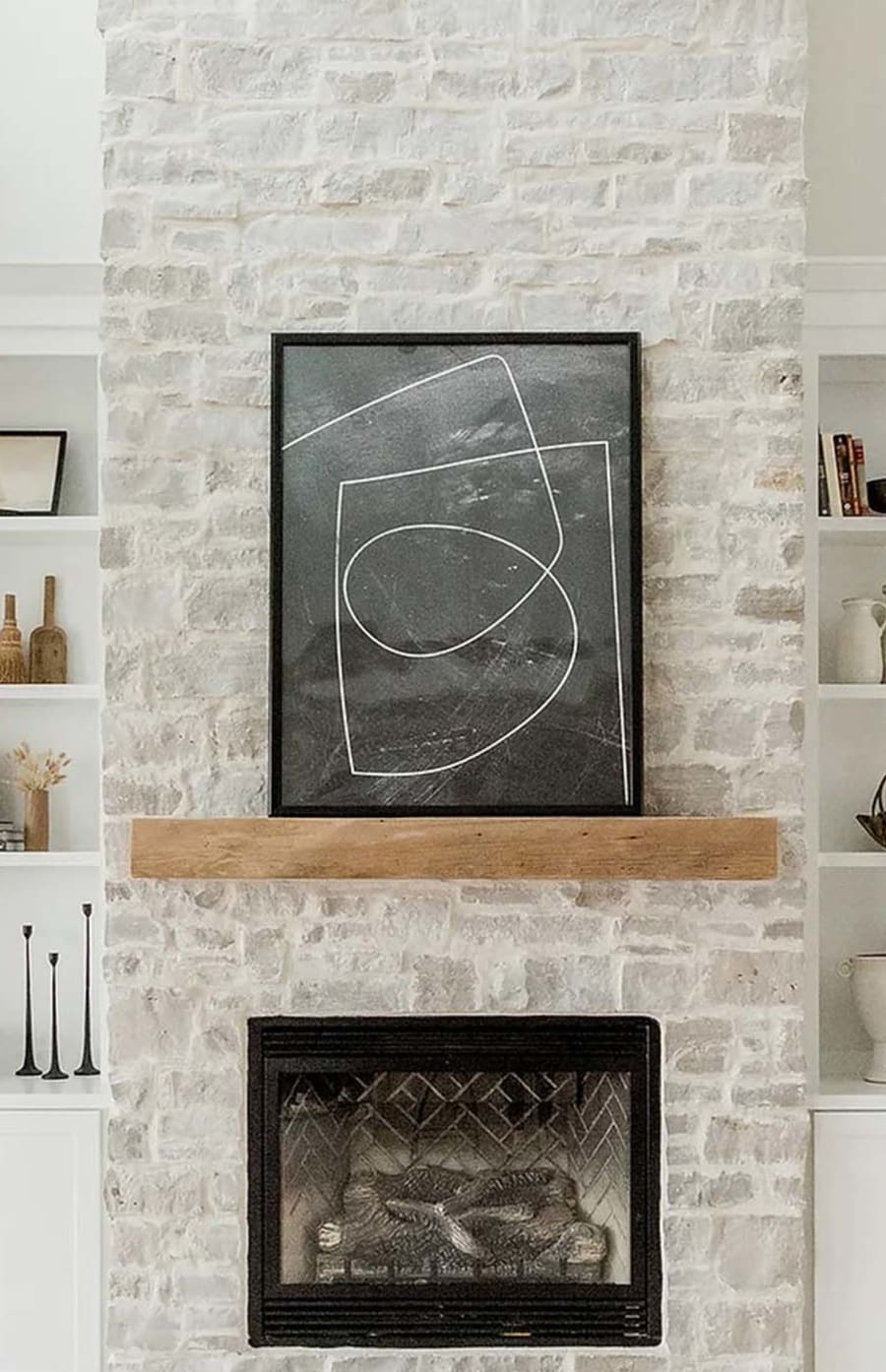 Interior home fireplace with light grey bricks.